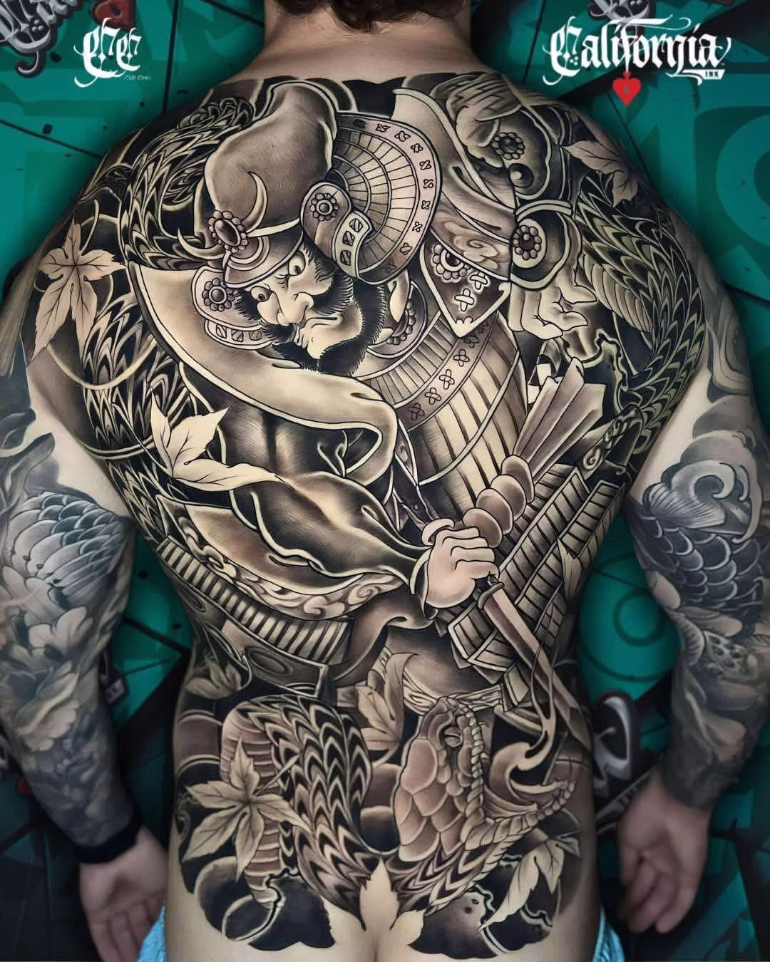 Full back black and grey Japanese-style tattoo
