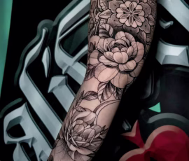 Floral tattoo sleeve with black and grey roses