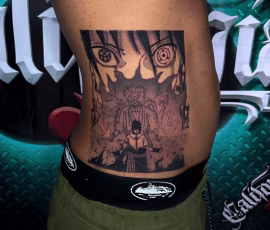 Anime tattoo depicting a shrine scene in sepia tones