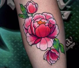 Floral tattoo in watercolor style with pink lilies and butterflies