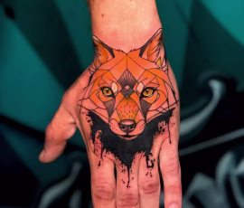Contemporary tattoo of a geometric fox with color gradient