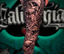 Black and grey statue realism sleeve tattoo