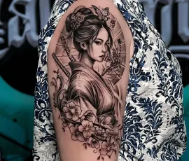 Japanese realism tattoo of a geisha with cherry blossoms
