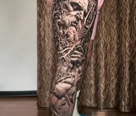 Healed black and grey statue realism sleeve tattoo