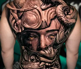 Black and grey back tattoo of a woman with goggles