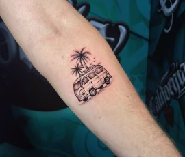 Micro realism tattoo of a camper van with a palm tree