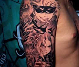 Anime tattoo in Thailand of a masked character with a wolf, on upper arm