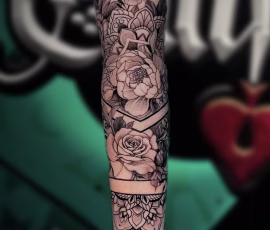 Floral tattoo sleeve with black and grey roses