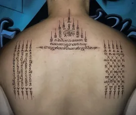 Sak Yant tattoo with traditional script columns