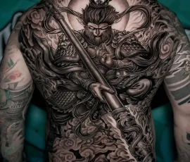 Japanese realism tattoo covering the entire back with a samurai warrior holding a sword