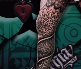 Geometric tattoo sleeve in thailand with on leg