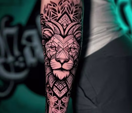 Geometric tattoo in thailand of a lion's face with dotwork mandala patterns, on forearm
