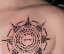 Sak Yant tattoo in a circular sacred script design