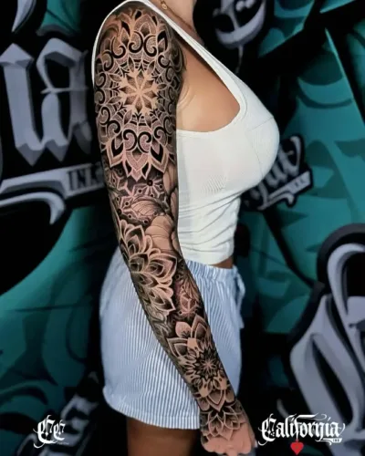 full-arm blackwork geometric and mandala sleeve tattoo