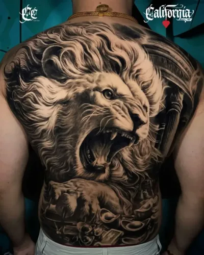 full-back black and grey realism tattoo features a powerful roaring lion